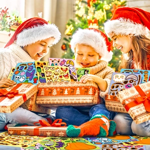 Children opening a gift box filled with Halloween pumpkin DIY puzzle stickers in a cozy room