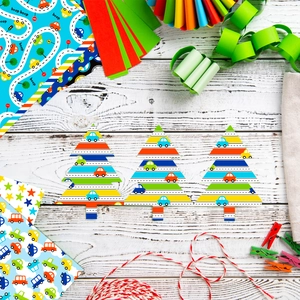 Detail of DIY scrapbook paper set with cute car patterns and paper Christmas trees
