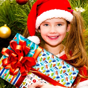 Blue gift wrapping paper with cartoon cars and a large red silk bow for kids