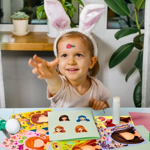 Girl creating DIY princess puzzle stickers with colorful cartoon characters and accessories
