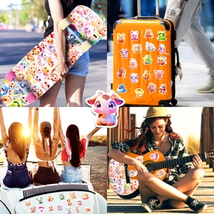 Detail of cute animal stickers on a skateboard and suitcase with cartoon animal designs