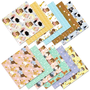 Detail of colorful puppy-themed scrapbook papers featuring bulldog and paw patterns
