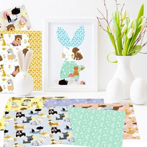 Detailed view of DIY scrapbook paper featuring various cute cartoon dog patterns and motifs