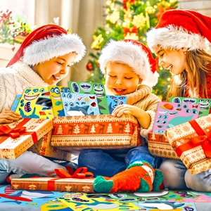 Children wearing Santa hats playing with DIY shark puzzle stickers in festive setting