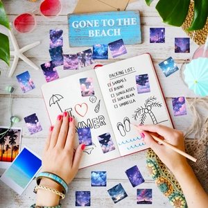 Detail of artistic starry sky stickers featuring dreamy clouds and sunset illustrations