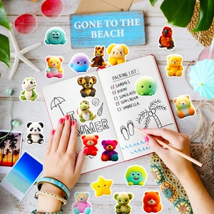 Detail shot of cute cartoon plush bear and monster stickers on summer beach themed desk