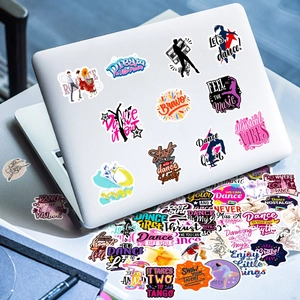 Detailed close-up of vinyl dance silhouette stickers on a white laptop surface