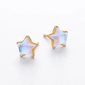Macro view of S925 silver star earrings with iridescent moonstone and golden finish