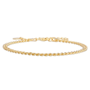Close-up of golden Cuban chain bracelet featuring a lobster clasp and extension chain