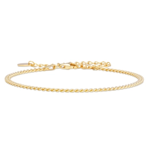 Detailed macro of a gold twisted chain bracelet with lobster clasp and adjustable link