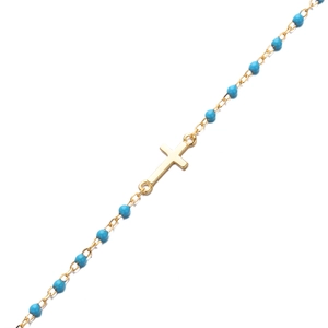 Détail d'un bracelet en argent S925 doré avec perles bleues et pendentif croix de style