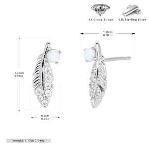 Macro view of 925 silver feather earrings with zircon inlays and opal stone detail