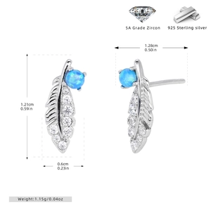 Macro detail of 925 silver feather earrings with blue opal and zircon stones