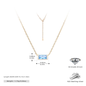 Detailed macro of 925 sterling silver lobster clasp and extension chain on gold necklace