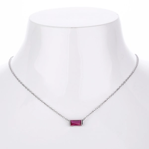 Detail of s925 silver necklace featuring a horizontal emerald-cut red zircon pendant