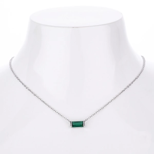 Detailed view of square emerald green gemstone pendant on slim s925 silver chain