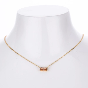 Close-up of a gold S925 silver necklace with a rectangular champagne zircon pendant