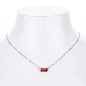 Close-up of S925 sterling silver necklace featuring a rectangular red zircon pendant