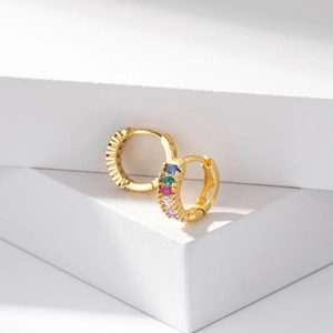 Minimalist 18K gold huggie earrings with colorful zircon stones in a circular arc design
