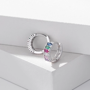 Close-up of S925 sterling silver huggie earrings with colorful inlaid faceted gemstones