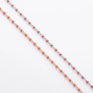 Close-up of S925 silver beaded chains with coral pink enamel beads in gold and silver