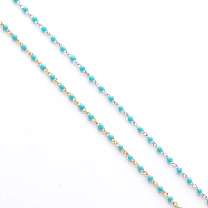 Detail of gold and silver S925 sterling silver bracelets with turquoise enamel beads