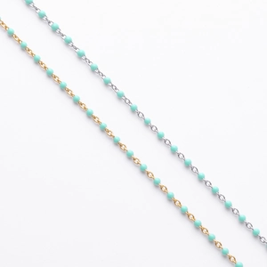 Detailed shot of gold and silver S925 sterling silver bracelets with light blue enamel beads