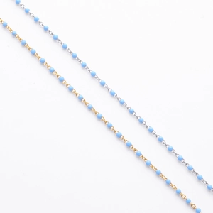 Close-up of S925 sterling silver chain featuring delicate light blue enamel beads