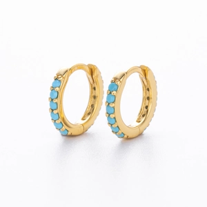 Detailed view of gold plated S925 silver hoop earrings with turquoise beads and claw setting