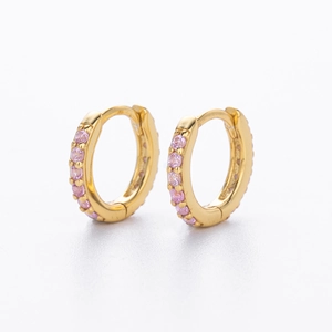 Detailed close-up of S925 sterling silver gold huggie earrings with pink cubic zirconia