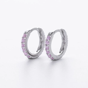 Macro view of S925 sterling silver hoop earrings set with small pink cubic zirconia stones