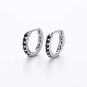 Macro shot of S925 sterling silver hoop earrings with pavé-set black cubic zirconia