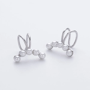 Close-up of S925 silver pearl ear cuffs with minimalist double-layer U-shaped design