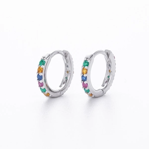 Detail of silver S925 huggie earrings with colorful inlaid cubic zirconia stones