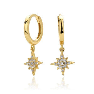 Detail of gold star pendant earrings with sparkling cubic zirconia on white background