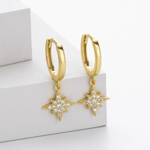 Close-up of gold-plated S925 sterling silver star earrings with pavé white zircon stones