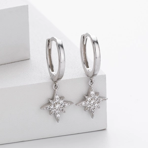 Detailed view of S925 sterling silver star earrings with sparkling cubic zirconia inlay