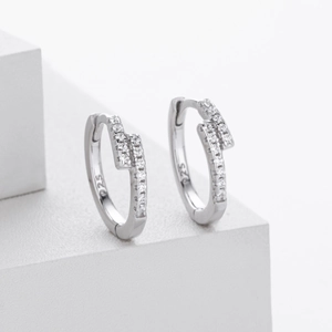 Macro shot of S925 sterling silver hoop earrings with double row zircon and hallmark