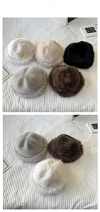 Flat lay of plush faux fur fisherman hats in five colors for winter warmth and comfort
