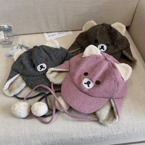 Winter plush bear ear trapper hats in grey, brown, and pink with warm fleece lining