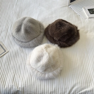 Plush faux fur bucket hats for women in grey, brown and white for winter warmth