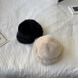Plush faux fur winter hats for women in black and beige, cozy warm thermal bucket style