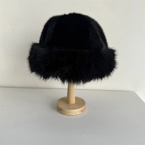 Winter plush faux fur bucket hat in black with thick thermal lining and ear protection