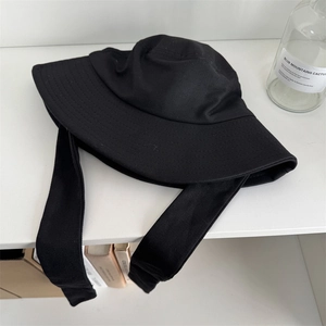 Minimalist black wide brim linen fisherman hat with adjustable ribbon chin strap
