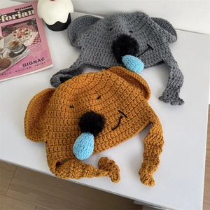 Cute koala knitted trapper hat with earflaps in grey and orange for winter warmth