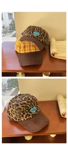 Detail of plaid and leopard baseball caps with heart embroidery and corduroy brim