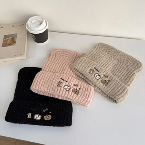 Chic knit beanies with apple embroidery in black, pink, and khaki for autumn