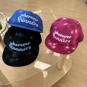 Flat brim baseball cap with graffiti letters in blue, black and rose pink cotton