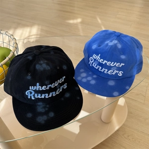 Graffiti polka dot baseball cap with 'wherever Runners' embroidery in blue and black