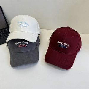 Vintage baseball caps with letter embroidery in white, grey, and burgundy colors
